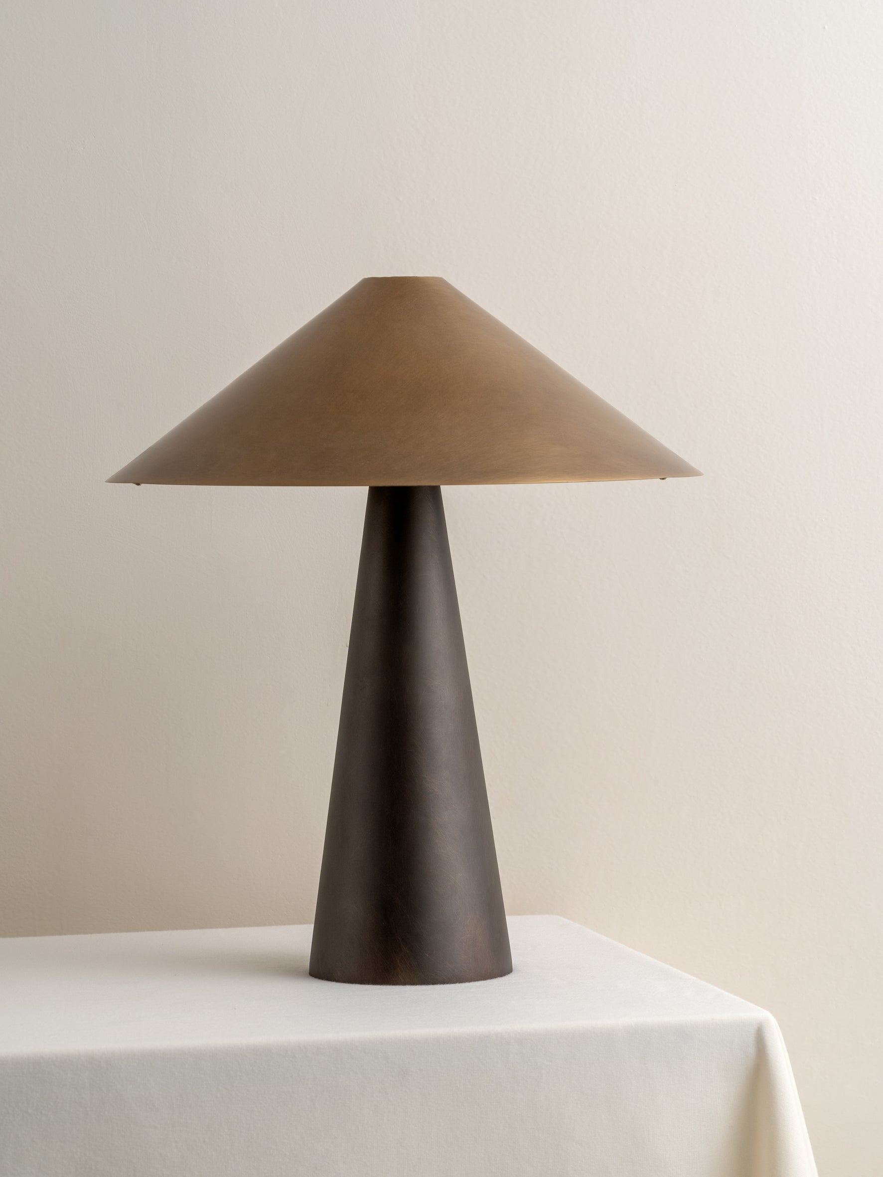 Orta - aged brass and bronze cone table lamp