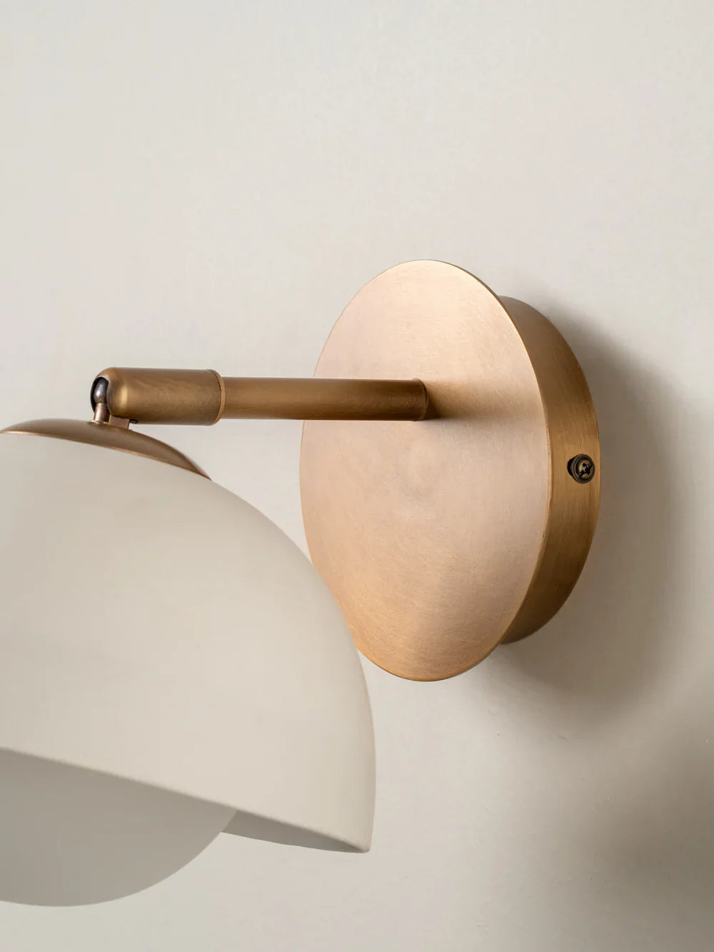 Porsa aged brass and warm white porcelain wall light